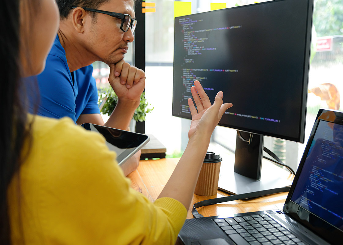woman pointing to computer screen